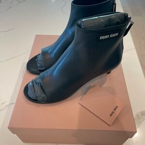 Miu Miu peep toe black leather bootie. New in box. Size 36.